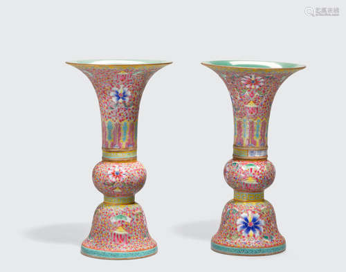 Yongzheng marks, 20th century A pair of famille rose enameled gu-form vases