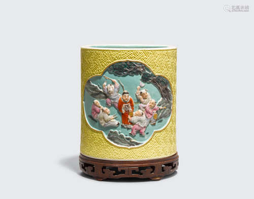 Wang Bingrong mark, Republic period  A famille rose enameled cylindrical brush pot with raised relief decoration