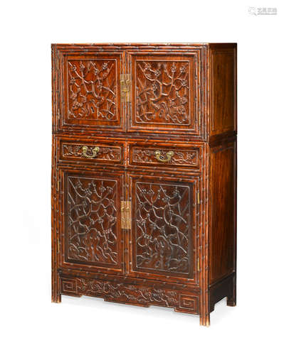 Republic Period A hardwood two-section cabinet with carved doors