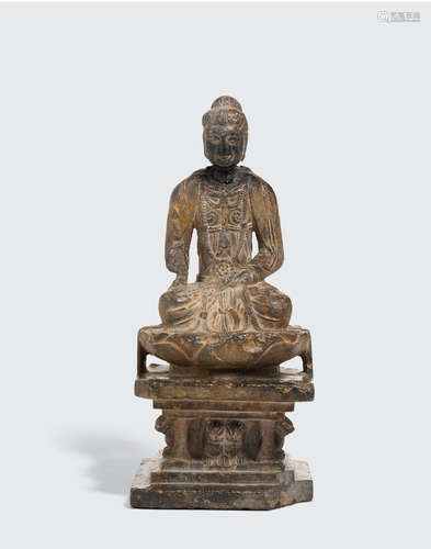 A gray stone seated Buddhist figure