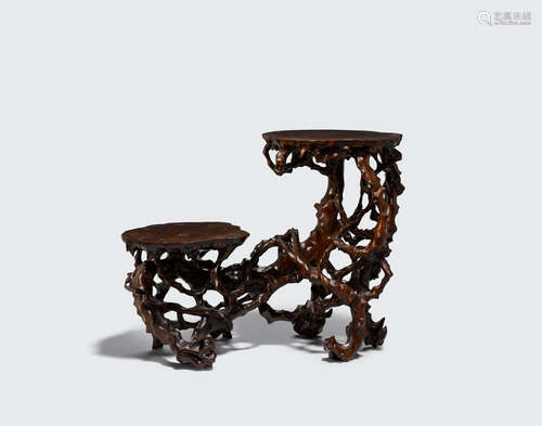 An elegant two tiered carved hardwood stand