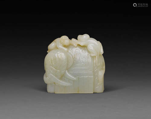 A carved jade elephant and monkeys group