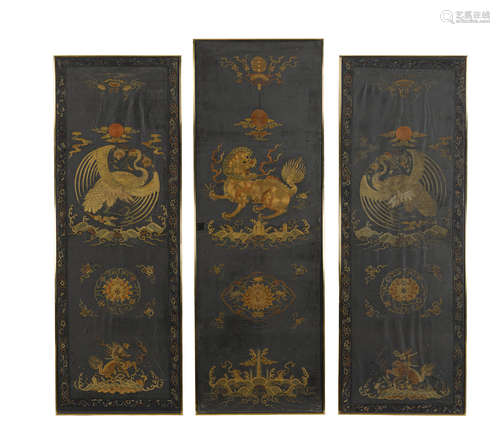 Kangxi period a group of THREE EMBROIDERED DARK BLUE SILK PANELS