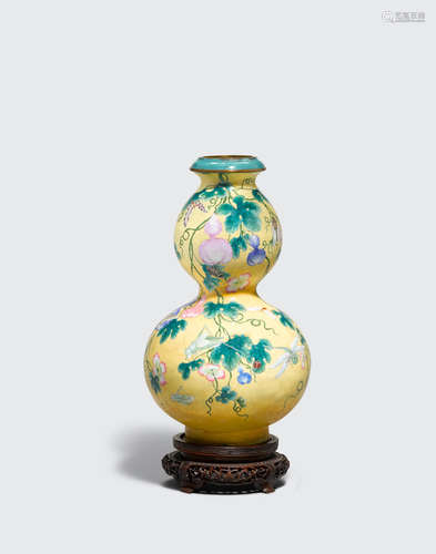 Qianlong mark, late Qing/Republic period A famille rose enameled metal double gourd vase