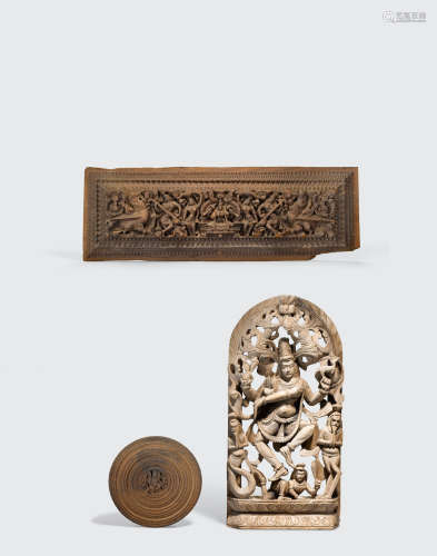 A group of three Indian carved wood plaques