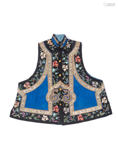 Late Qing/Republic period A woman's blue brocade silk vest with embroidered trim