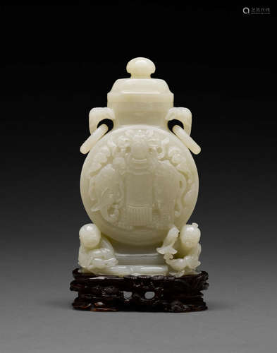 20th century A white jade covered jar with elephant and fish reserves and stand