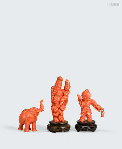 A GROUP OF THREE CORAL CARVINGS