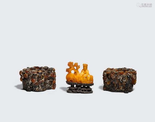 A group of three amber carvings