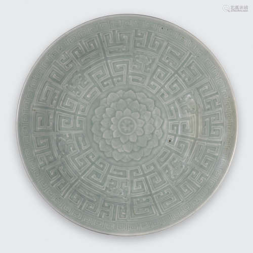 Qianlong mark, 19th century A celadon glazed charger with lotus and dragon decoration