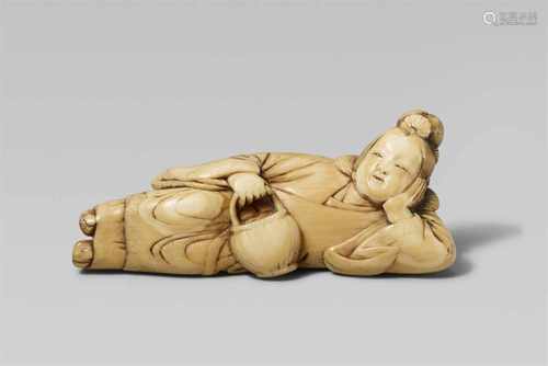 A good ivory netsuke of a reclining servant of Seiôbô. 18th centuryThe head propped up on her left