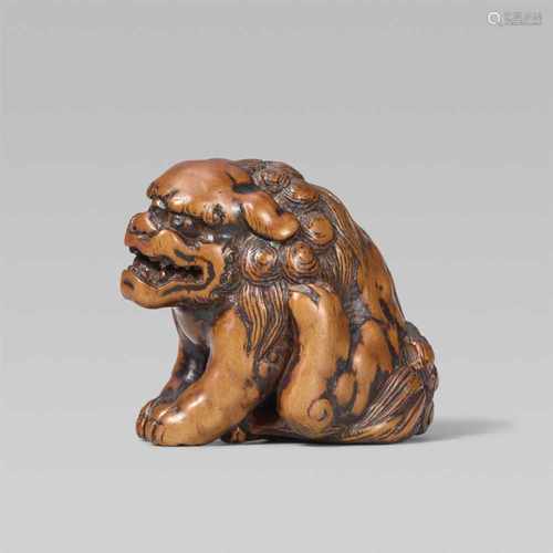 A good large boxwood netsuke of a shishi. Late 18th/early 19th centurySeated with forepaws placed