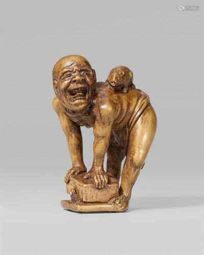 A boxwood okimono-type netsuke of a rat catcher. Late 19th centuryStanding wearing only a fundoshi