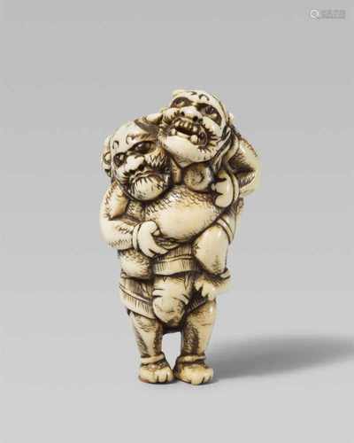 A good and amusing ivory netsuke of two wrestling onis. Early 19th centuryThe heavy-set oni stands