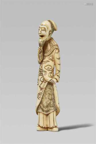 An ivory netsuke of a comical Chinese man. Early 19th centuryStanding with head slightly turned to