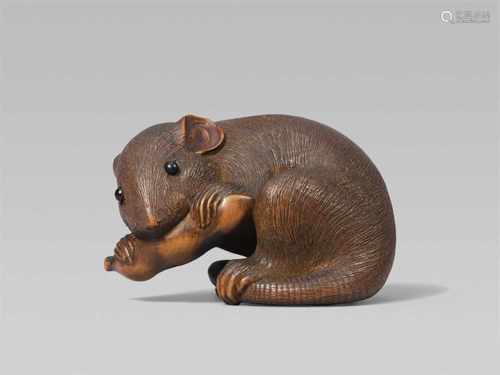 A large Ise school okimono-type boxwood netsuke of a rat, by Masanao. Late 19th centurySitting