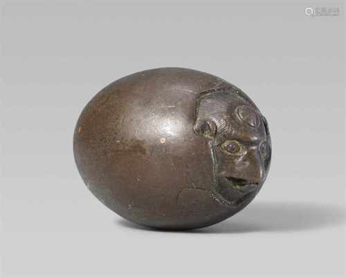 An unusual and rare bronze netsuke of a tengu no tamago. Early 19th centuryThe crow-headed tengu