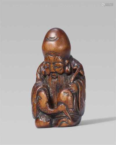 A boxwood netsuke of Jurôjin. 19th centurySeated with a crane on his thigh and holding a jui sceptre