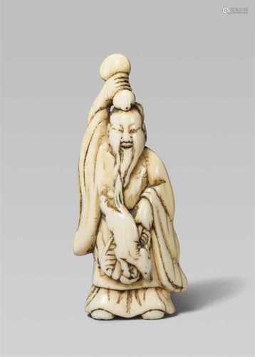 An ivory netsuke of Chôkarô Sennin. Late 18th /early 19th centuryThe bearded sennin in Confucian