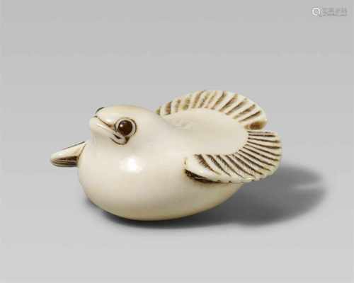 An ivory netsuke of a fukura suzume. 19th centuryThe stylised sparrow sits with tail erect and wings