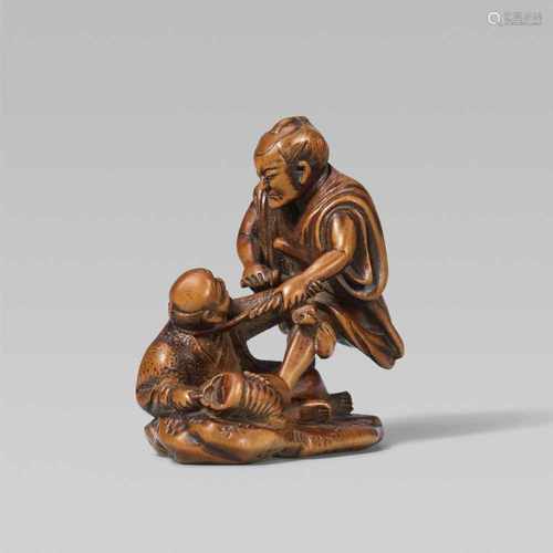 An interesting boxwood netsuke of a samurai catching a thief, by Masayoshi. Second half 19th