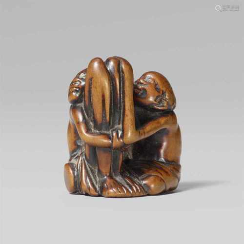 A fine boxwood netsuke of an ashinaga and a tenaga. Early 19th centuryRepresented as curly-haired