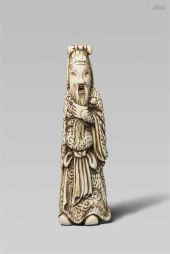 An ivory netsuke of Kan’u. Early 19th centuryThe bearded Chinese general stands holding his