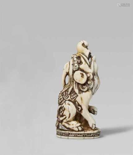 A very impressive and large seal netsuke of a baku. Early 19th centurySeated on its haunches on a