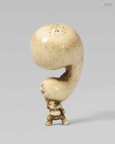 A stag antler netsuke of a sumô wrestler with a huge gourd. 19th centuryStanding in balance with