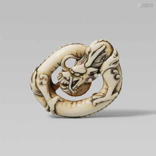 An ivory netsuke of a coiled dragon. Mid-19th centuryThe smooth body without scales slung into a