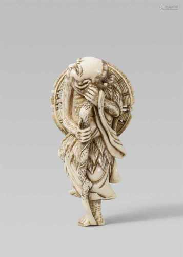 An ivory netsuke of a grumpy Chinnan Sennin. Early 19th centuryThe bearded sennin standing on one