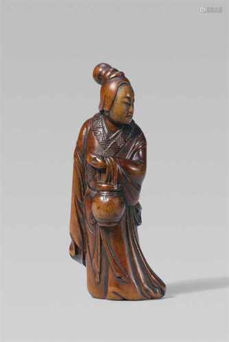 A good boxwood netsuke of a servant of Seiôbô. 18th centuryStanding turned to the right and