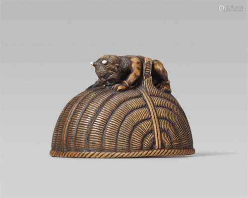 An amusing wood netsuke of an oni and Shôki, by Chikusai. Second half 19th centuryA long-haired