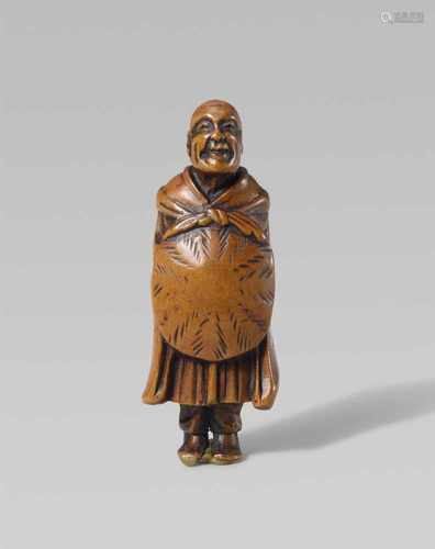 A boxwood netsuke of Saigyô Hôshi. First half 19th centuryStanding with head slightly raised, a