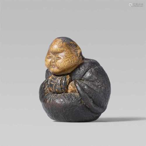 An unusual and small lacquered wood netsuke of Okame. 19th centurySeated and crouched forward, the