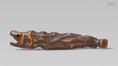 A good boxwood netsuke of a dried salmon. First half 19th centuryWith a ferociously open mouth,