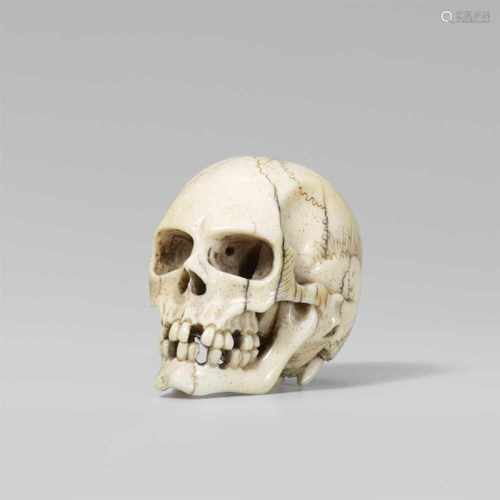 A fine and realistic ivory model of a skull. Late 19th centuryThe human skull with various