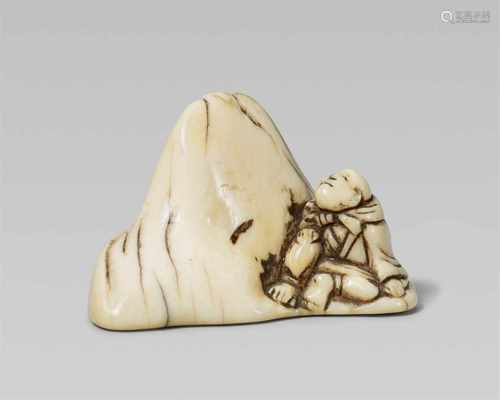 An ivory netsuke of Saigyô Hôshi admiring Mount Fuji. Early 19th centurySitting with a bundle tied