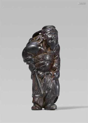 A wood netsuke of Shôki, by Tomochika. Early 19th centuryStanding with one leg slightly raised,