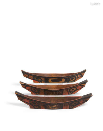 Three Haida model canoes