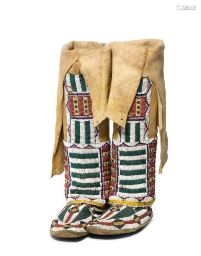 A pair of Cheyenne girl's beaded hightop moccasins