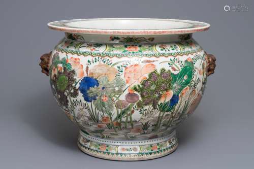 A Chinese famille verte fish bowl with birds among flowers, 19/20th C.