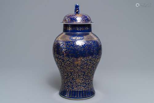 A Chinese powder blue-ground and gilt vase and cover, Kangxi mark, 19/20th C.