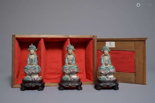 Three Chinese enamel on biscuit figures of Buddha, 19th C.