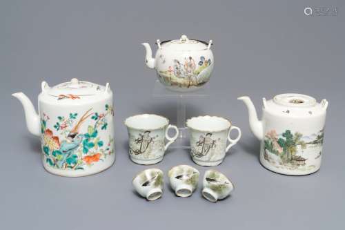 Three Chinese famille rose and qianjiang cai teapots and five cups, 19/20th C.