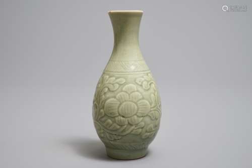 A Chinese relief-decorated celadon 'peony' vase, 18/19th C.