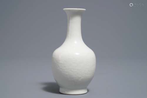 A Chinese blanc de Chine bottle vase with incised anhua design, ca. 1900