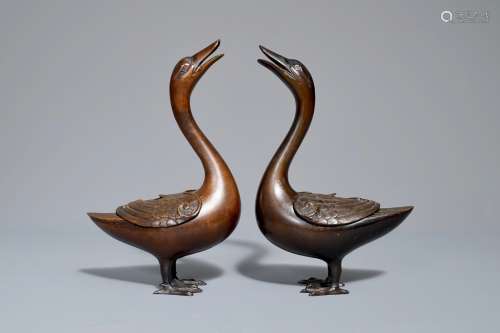 A pair of Chinese bronze duck-shaped incense burners and covers, 18th C.