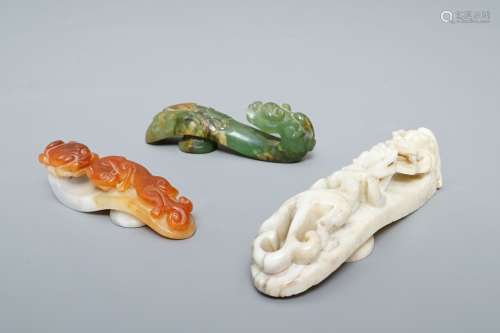 Three Chinese jade belt hooks, 19th C.