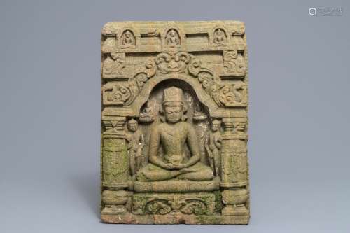 A sandstone Khmer relief depicting the seated Buddha in a temple, 12/13th C.
